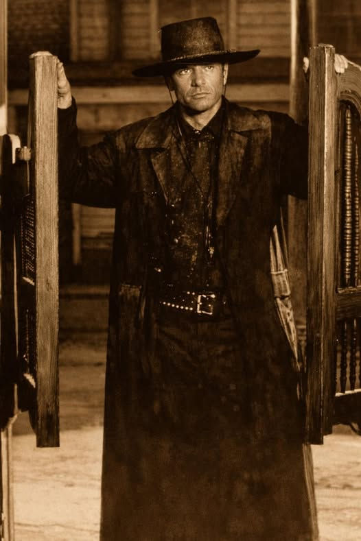 Chris standing at saloon door